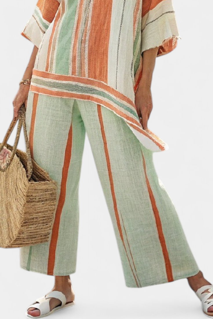 Chic Striped Ensemble Featuring Asymmetrical Blouse and Wide-Leg Pants for a Sophisticated Look
