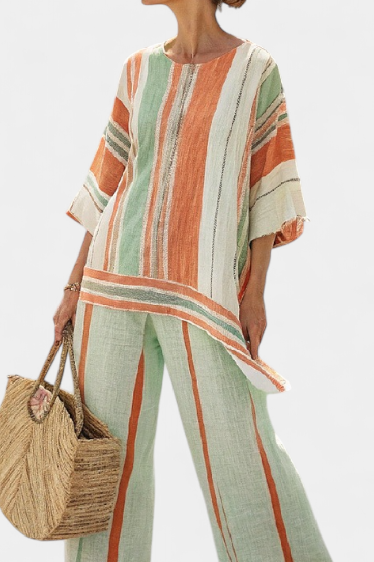 Chic Striped Ensemble Featuring Asymmetrical Blouse and Wide-Leg Pants for a Sophisticated Look